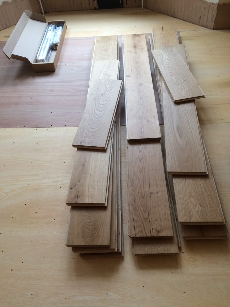 Engineered Wide Oak Boards Acclimatising post fitting ply board to level floor. Gloucester.