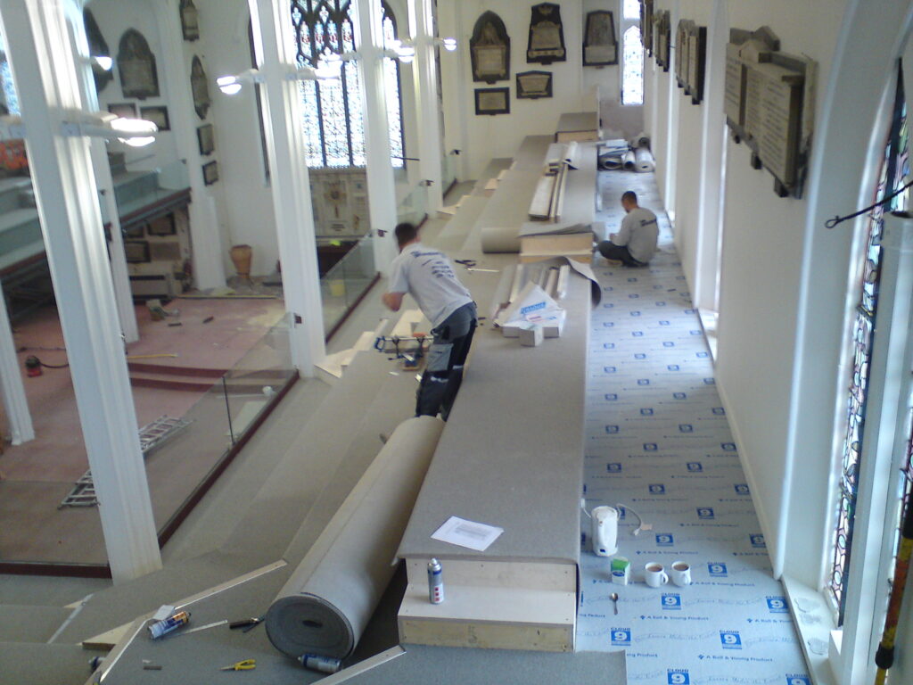 The team at Parsons flooring laying a carpet in a commercial Building